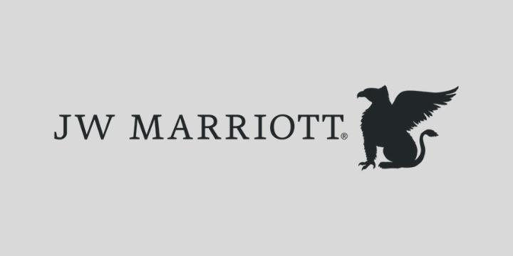 A logo or JW Marriott showcasing TSWING Wholesale Tea partners