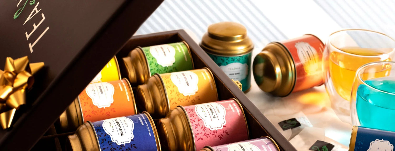 A box tswing labelled tea cannisters showcasing b2b white label wholesale tea offering